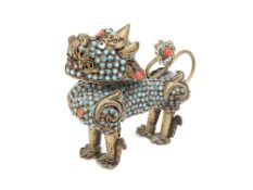 An inlaid brass and metal dog of foo (possibly Tibetan)