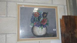 An oil painting still life study of a vase of flowers signed M Cole,