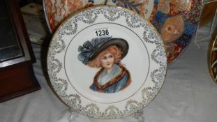 A bone china plate with motif of a lady