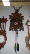 A large carved wood cuckoo clock