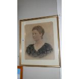 A framed and glazed portrait of a lady