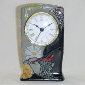 A Moorcroft 'Courting Birds' clock designed by Emma Bossons