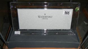 A boxed Waterford crystal photo frame