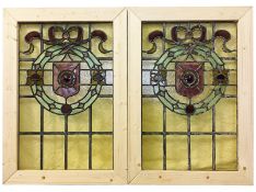 A pair of Victorian stained glass windows with 6 spare pieces, 80.5 x 56.