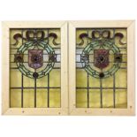 A pair of Victorian stained glass windows with 6 spare pieces, 80.5 x 56.