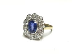 An 18ct gold diamond and sapphire ring,