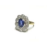 An 18ct gold diamond and sapphire ring,