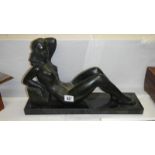 A figure of a reclining nude