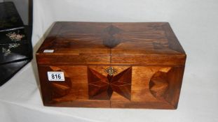 A mahogany inlaid box with key
