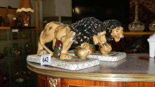 A pair of Staffordshire style lions