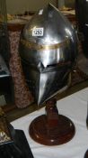 A replica medieval pigface bascinet helmet