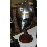 A replica medieval pigface bascinet helmet