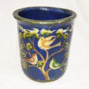 A blue lacquered desk bin painted with birds in the style of William Morris