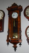 A good Victorian 2 weight walnut Vienna clock