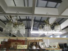 A pair of 6 lamp chandeliers