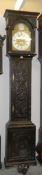 A carved oak brass faced Grandfather clock, Will Snow,