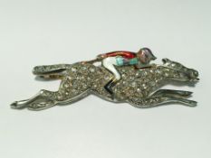 A diamond and enamel jockey brooch