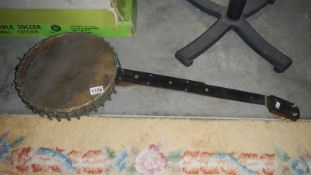 An old banjo in poor condition