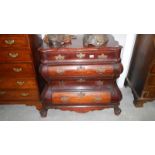 A French mahogany bombe front 6 drawer chest