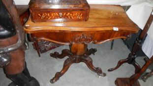 A Victorian fold over tea table