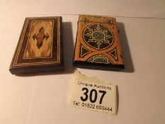 A wooden card case and one other