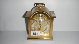 A brass carriage style clock
