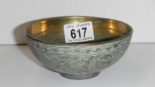 A Chinese brass finger bowl decorated with dragons