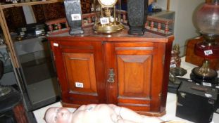 A Victorian mahogany 2 door wall hanging corner cupboard