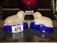 A pair of 19th century Staffordshire pen holders as sheep (W mark on underside)