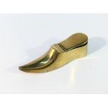 A Victorian brass shoe snuff box