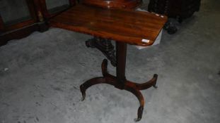 An unusual regency rosewood reading stand with sliding and rise and fall top for height adjustment