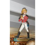 A Johnnie Walker advertising figure (label has some wear)