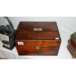 A rosewood and mother of pearl vanity box with blue silk interior,