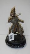 A finely cast 20th century figure of an Eastern dancer on a wooden stand