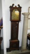 An 18th Century oak longcase clock with 'John Spinks Revesby' brass arch 8 day automaton movement.