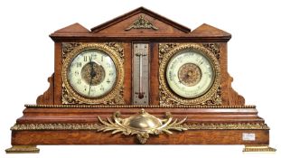 An oak cased clock/barometer