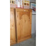A single door pine cupboard