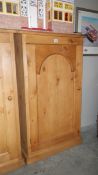 A single door pine cupboard