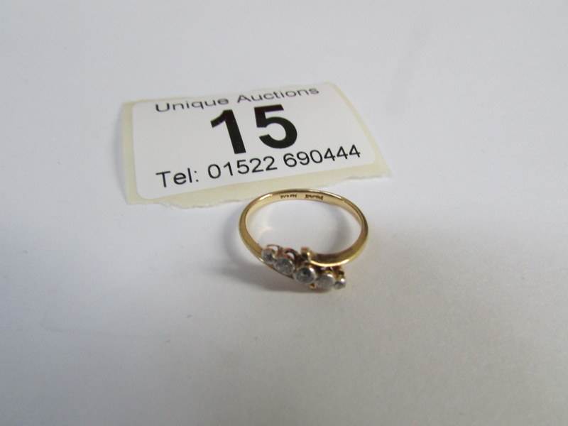 An Edwardian gold and platinum set 5 diamond cross over ring