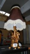 A figural table lamp