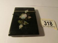 A mother of pearl and lacquered card case, 9 x 6.