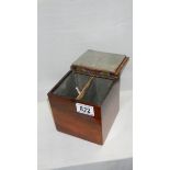 A mahogany tea caddy