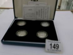 A cased set of 4 silver proof Piedfort £1 coins, 1999, 2000,
