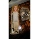 An old wax doll and other items