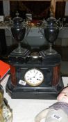 A Victorian black 3 piece clock garniture in working order