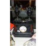 A Victorian black 3 piece clock garniture in working order