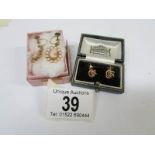 A pair of 9ct gold cameo earrings and a pair of 9ct gold stud earrings