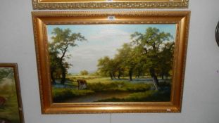 A gilt framed oil on canvas 'Old Lady Picking Bluebells' signed Colin Webster,