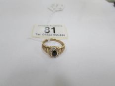 An oval sapphire and diamond yellow gold ring,
