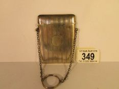 A silver card case on chain, Birmingham 1871, 8.